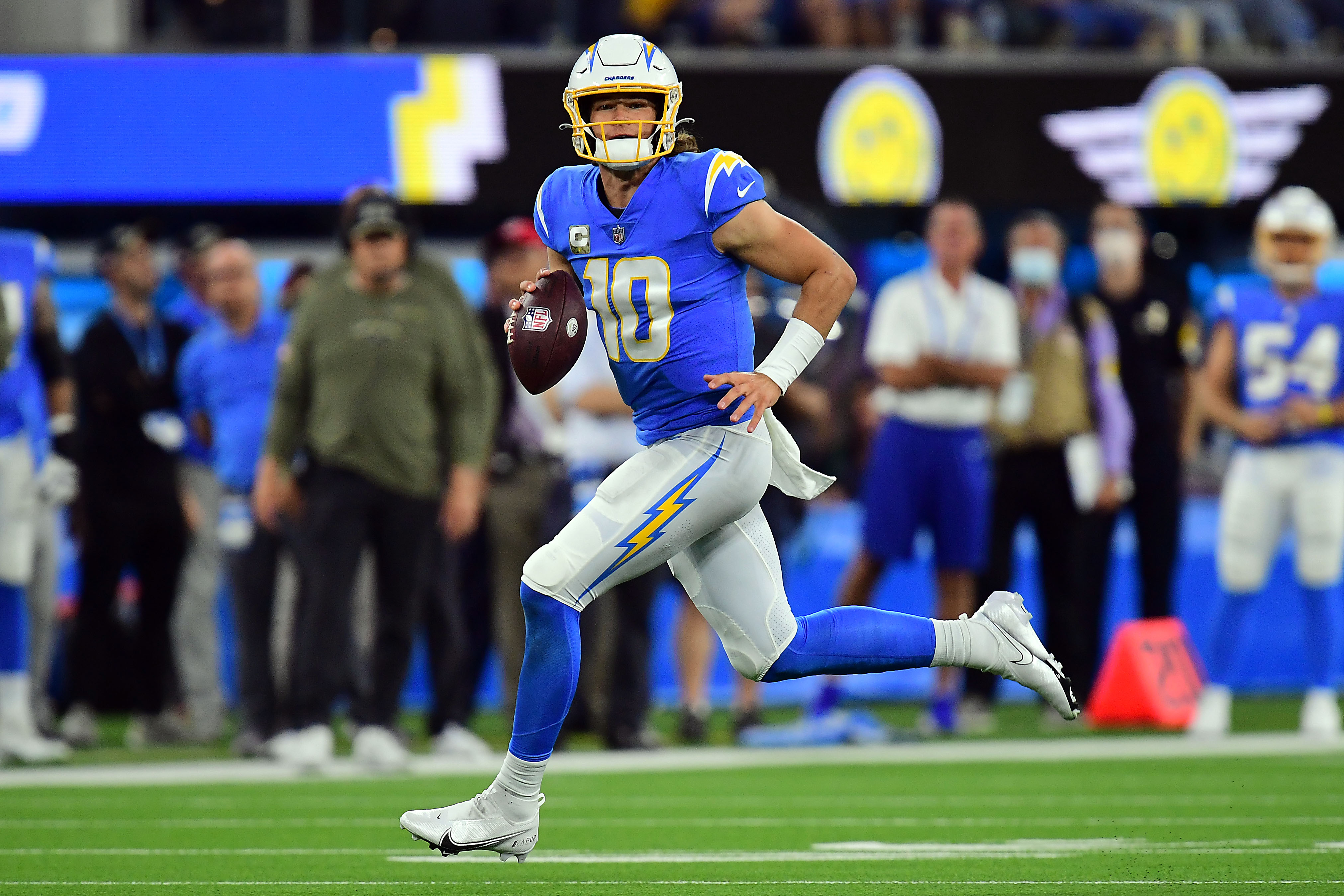 Nov 21, 2021; Inglewood, California, USA; Los Angeles Chargers quarterback Justin Herbert (10) runs the ball against the Pittsburgh Steelers during the first half at SoFi Stadium. Mandatory Credit: Gary A. Vasquez-USA TODAY Sports